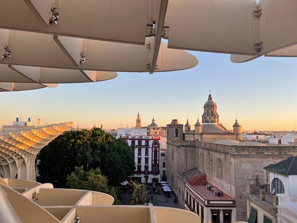 Witnessing how beautiful the sun illuminates Seville's blend of modern and historic structures.