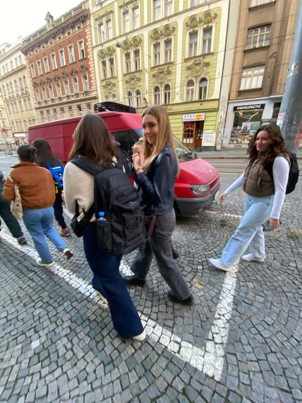 students walking through crowded European street