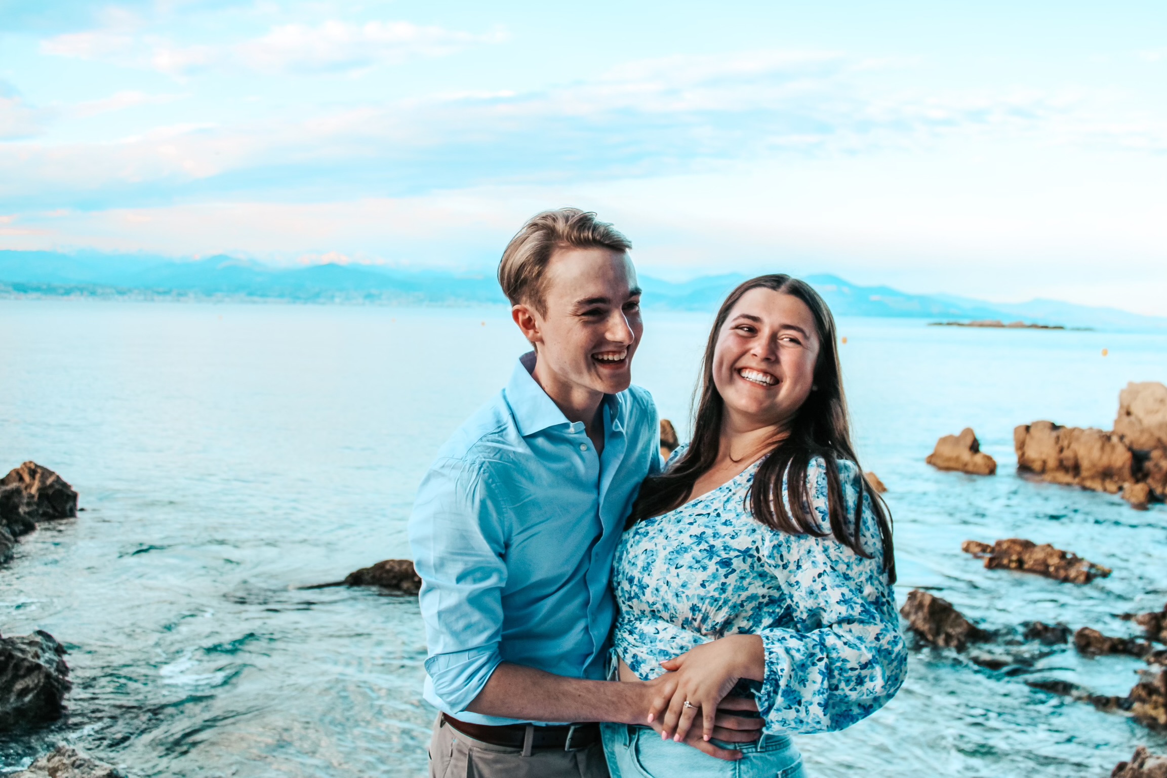 Couple laughing post-proposal