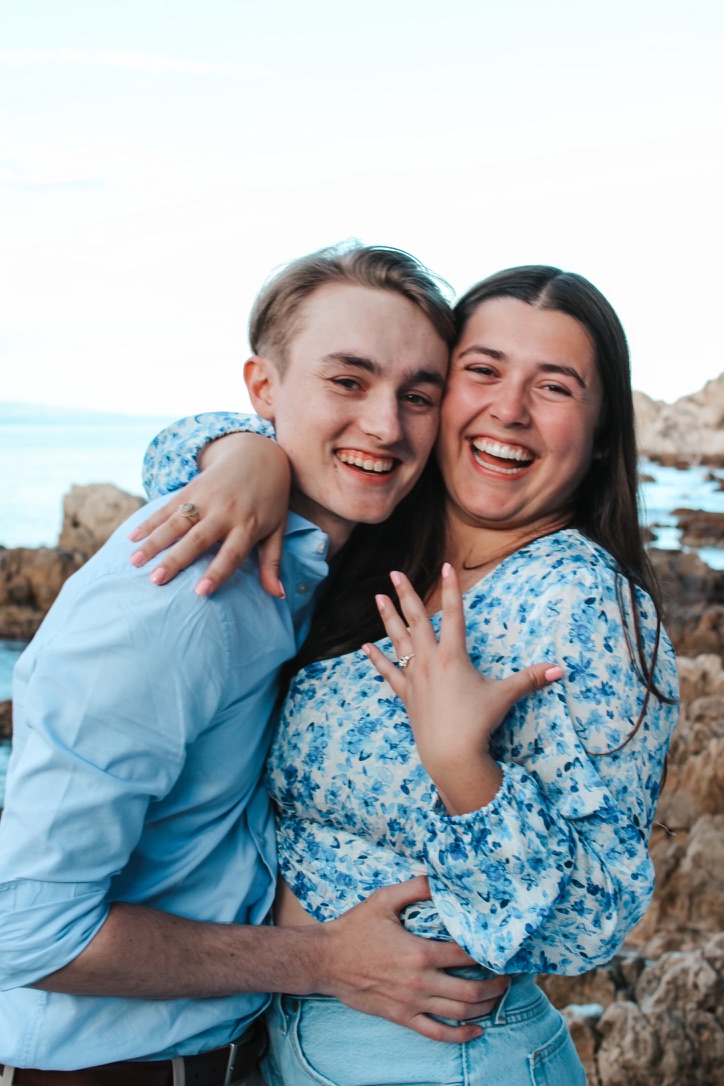 Happy couple smiling after getting engaged!