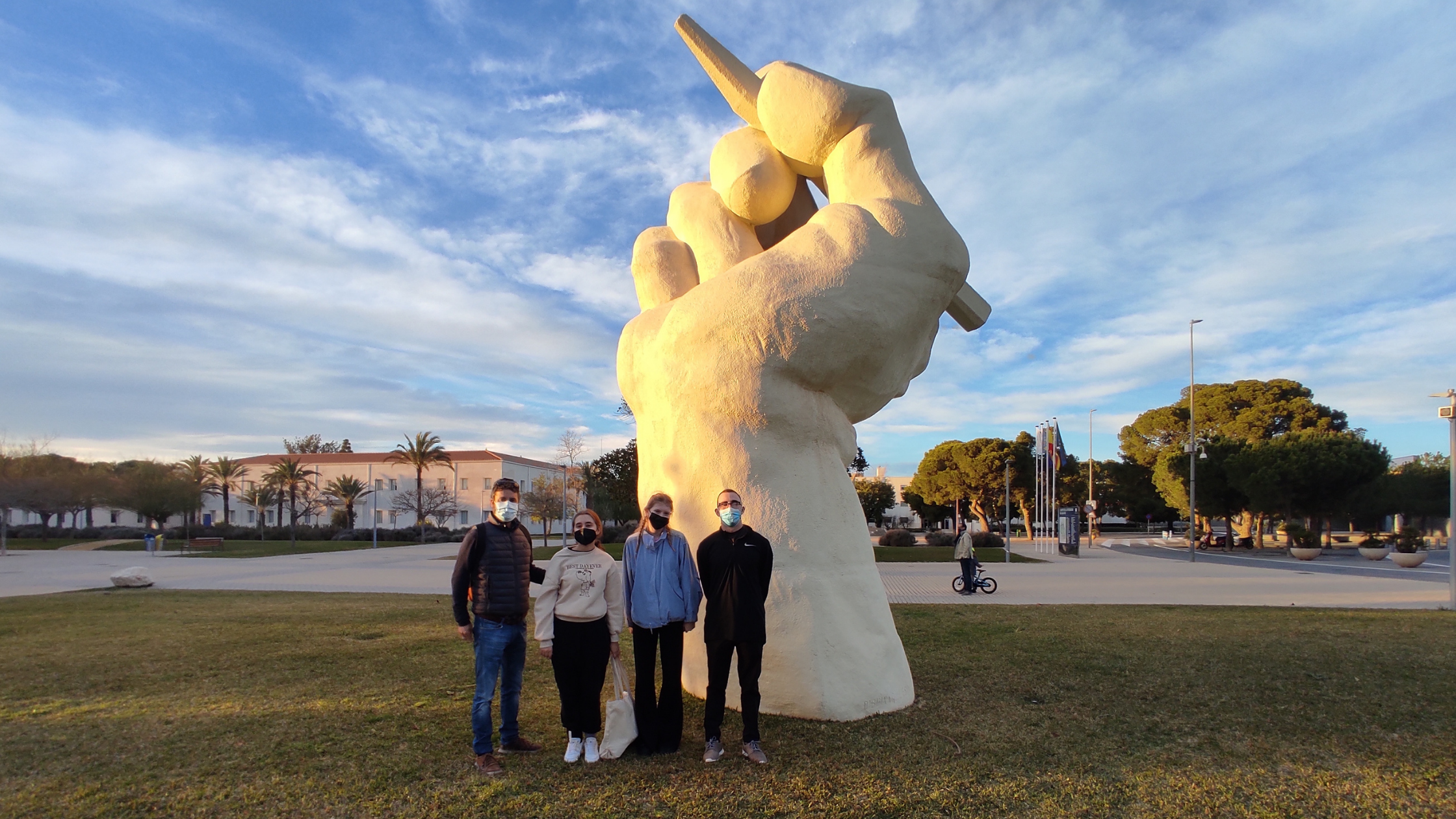 Students in front of statue