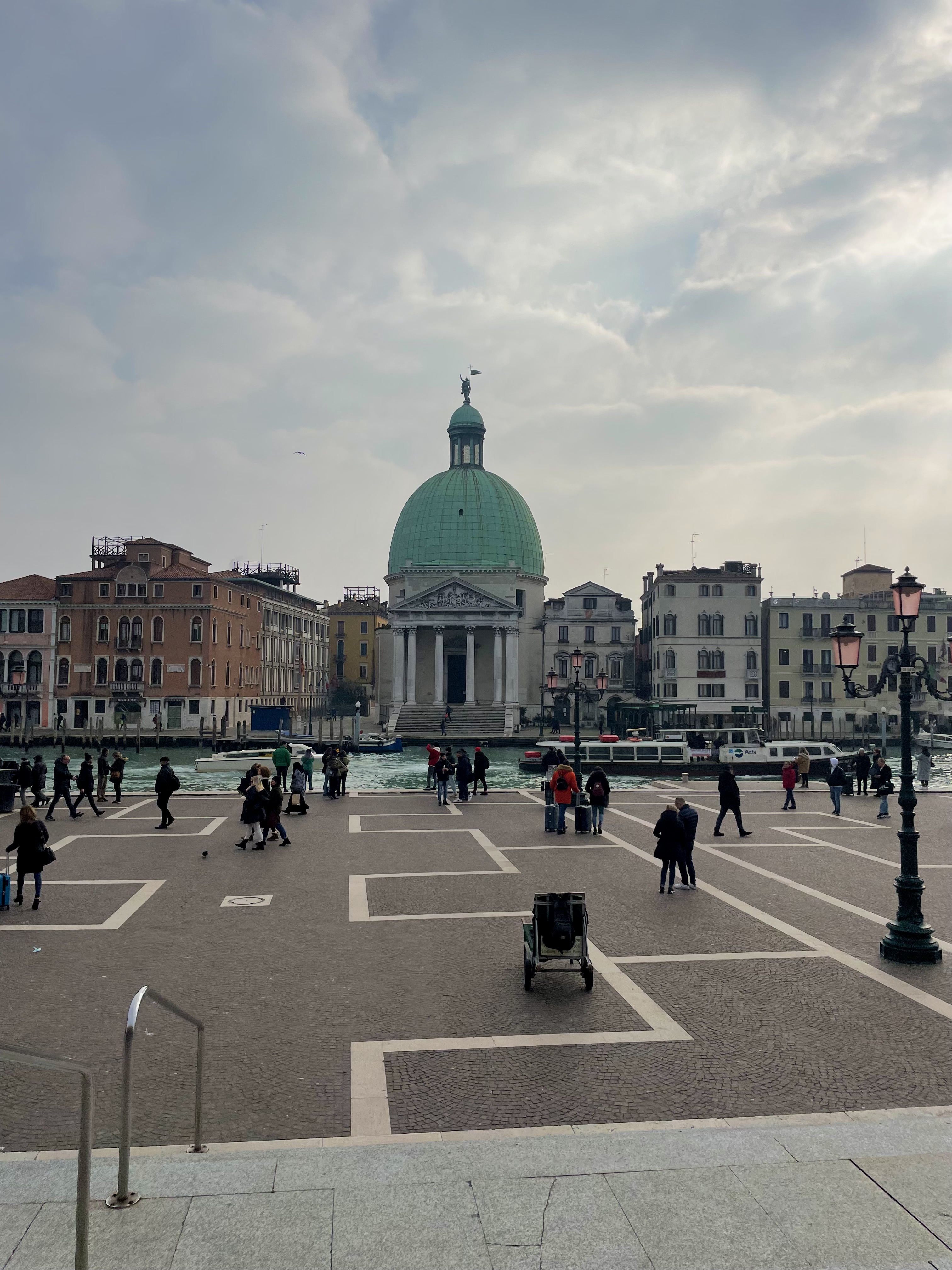 View of river and buildings outside of the Venice Train Station.