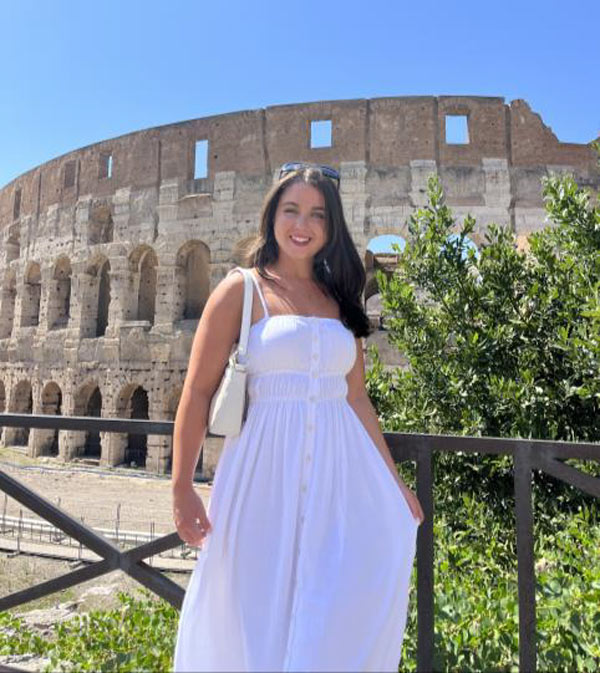 headshot in front of colosseum