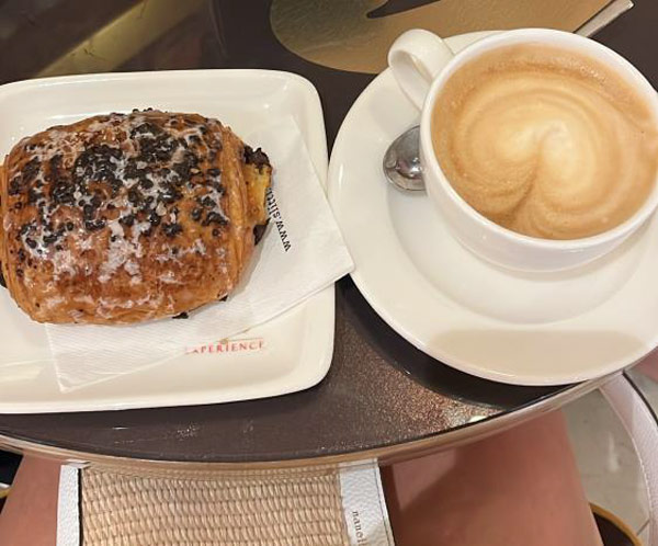 Cappuccino and chocolate croissant at an included breakfast!