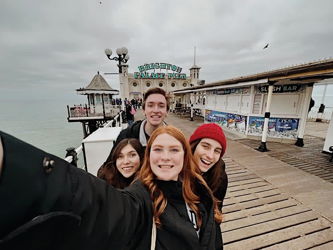 students smiling at beach