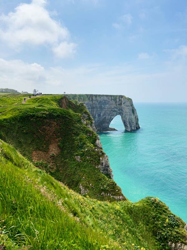 Clear blue sea and green grass at Etretat Normandy