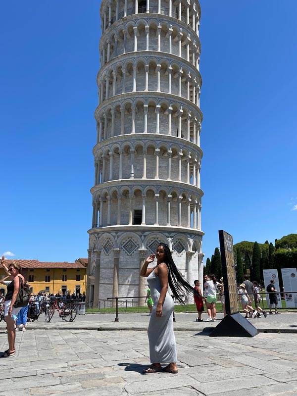 Student standing in front of Pisa