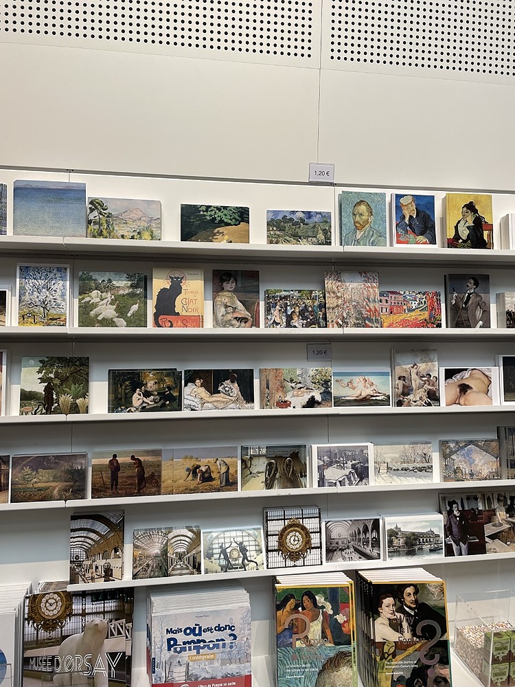 Shelves filled with variety of art at Musee d'Orsay gift shop