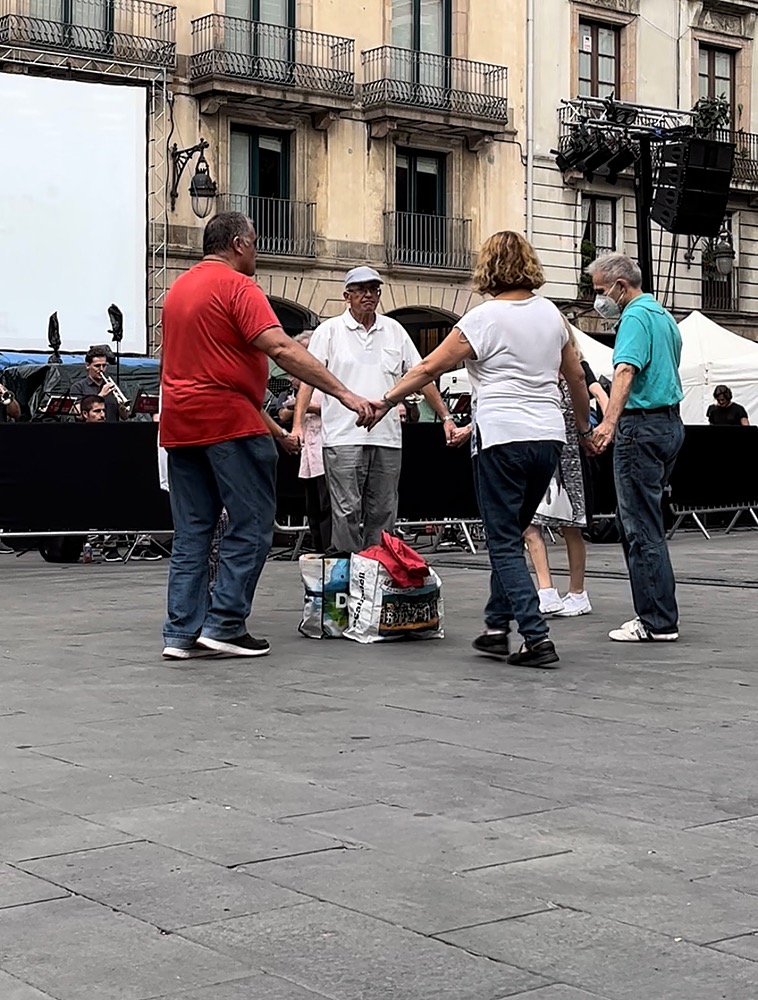 Dancers performing La Sardana, a traditional Catalan dance.