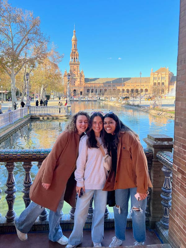 Friends looking over the water at the Plaza