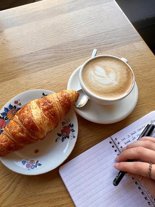 Coffee and croissant at cafe