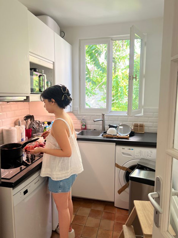 Student making food in kitchen