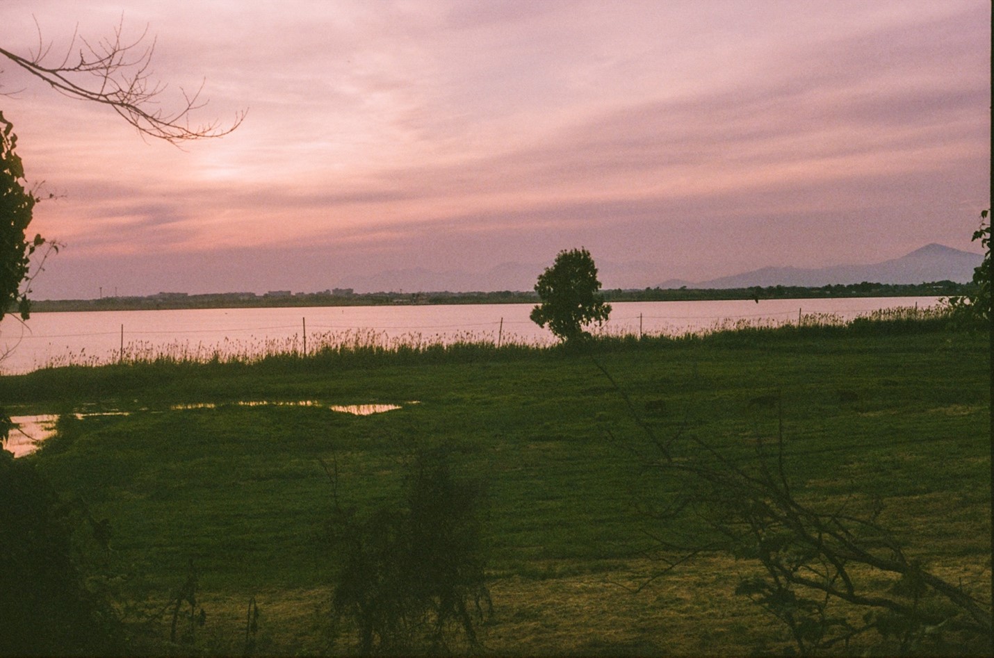 Pink and orange sunset over lake