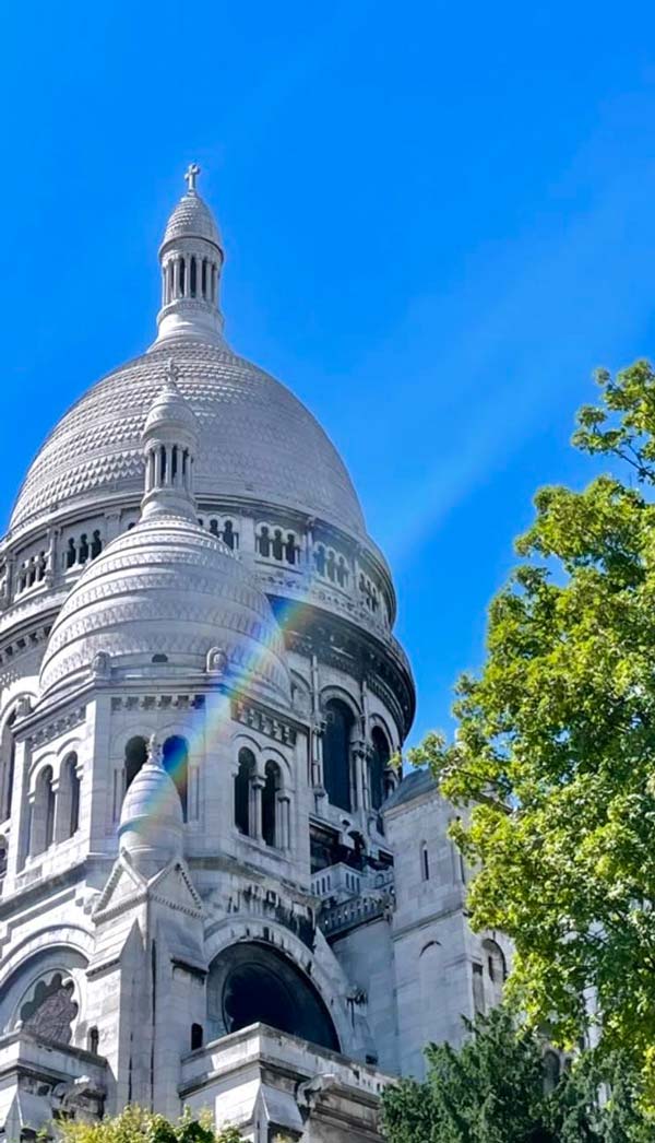 A rainbow comes out for pride at the sacre coeur in montmartre