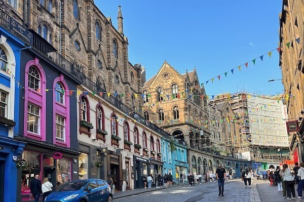 People walking along European street and buildings