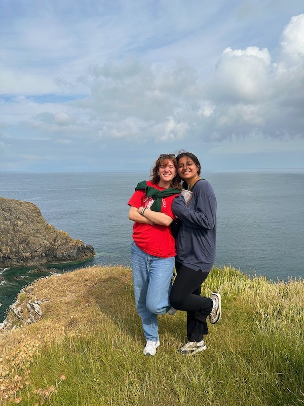 Two people pose on the Welsh Coast
