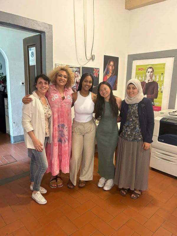 group of student interns and volunteers taking a group pic